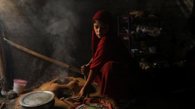 Shofika Begum, now married, cooks inside her shelter at the Kutupalong refugee camp. The happiness of their wedding day belies the uncertainty that Saddam and Shofika feel about their future in the overcrowded camp. “We will wait to have children,” Saddam said. “We need to know whether we are staying here or going back to Myanmar first. I would only return if we are given Myanmar nationality.” (Marko Djurica / REUTERS) Shofika Begum, now married, cooks inside her shelter at the Kutupalong refugee camp. The happiness of their wedding day belies the uncertainty that Saddam and Shofika feel about their future in the overcrowded camp. “We will wait to have children,” Saddam said. “We need to know whether we are staying here or going back to Myanmar first. I would only return if we are given Myanmar nationality.” (Marko Djurica / REUTERS)