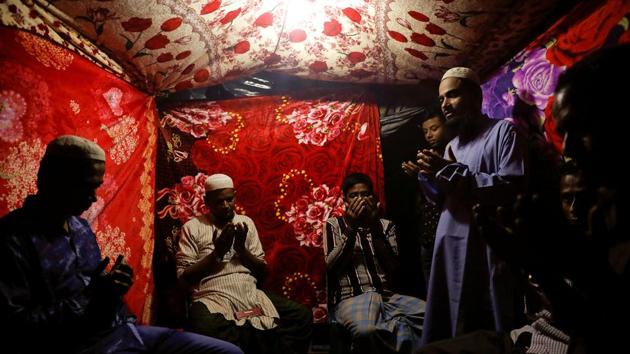 A Muslim cleric (R) officiates the ‘nikah’ ritual first for Saddam Hussein (L), and then Shofika Begum at the Kutupalong camp near Cox’s Bazar. Only men attended this ceremony on Saddam’s side and vice versa. (Damir Sagolj / REUTERS) A Muslim cleric (R) officiates the ‘nikah’ ritual first for Saddam Hussein (L), and then Shofika Begum at the Kutupalong camp near Cox’s Bazar. Only men attended this ceremony on Saddam’s side and vice versa. (Damir Sagolj / REUTERS)