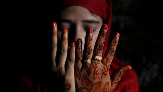 Shofika Begum, 18, shows decoration on her hands on the day she married Saddam Hussein, 23, both Rohingya refugees. The couple, from the village of Foyra Bazar in Maungdaw township that was burnt by the Myanmar military, fled with their families some three months ago. They knew each other prior to escaping Myanmar but managed to wed only now, as refugees in Bangladesh. (Damir Sagolj / REUTERS) Shofika Begum, 18, shows decoration on her hands on the day she married Saddam Hussein, 23, both Rohingya refugees. The couple, from the village of Foyra Bazar in Maungdaw township that was burnt by the Myanmar military, fled with their families some three months ago. They knew each other prior to escaping Myanmar but managed to wed only now, as refugees in Bangladesh. (Damir Sagolj / REUTERS)