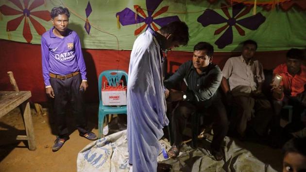 In a nearby tent Saddam Hussein gets dressed in an all-male space decorated by colourful blankets. (Damir Sagolj / REUTERS) In a nearby tent Saddam Hussein gets dressed in an all-male space decorated by colourful blankets. (Damir Sagolj / REUTERS)