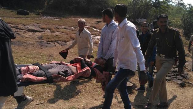 Injured trekker Shravan Sawant being carried in a makeshift stretcher. (HT Photo) Injured trekker Shravan Sawant being carried in a makeshift stretcher. (HT Photo)