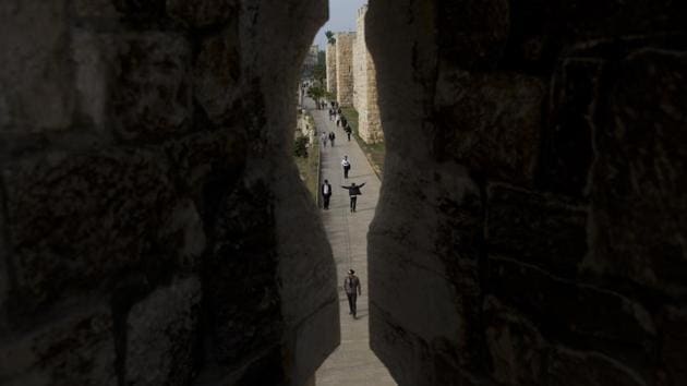 People coursing through Jerusalem’s Old City seen trough the city walls at Jaffa Gate. Today, the 2.5-mile (4 kilometer) circuit around the Old City brings visitors face-to-face with Jews, Muslim and Christian Arabs, Armenians, men and women of the cloth and tourists from around the globe. (Oded Balilty / AP) People coursing through Jerusalem’s Old City seen trough the city walls at Jaffa Gate. Today, the 2.5-mile (4 kilometer) circuit around the Old City brings visitors face-to-face with Jews, Muslim and Christian Arabs, Armenians, men and women of the cloth and tourists from around the globe. (Oded Balilty / AP)