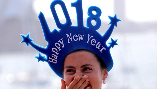 A spectator laughs as she waits for the annual new year fireworks as part of celebrations on Sydney Harbour, Australia, December 31, 2017. (Reuters Photo) A spectator laughs as she waits for the annual new year fireworks as part of celebrations on Sydney Harbour, Australia, December 31, 2017. (Reuters Photo)