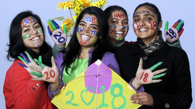 Students of a university painted their faces as part of New Year celebrations in Patiala on Sunday. (Bharat Bhushan /HT)