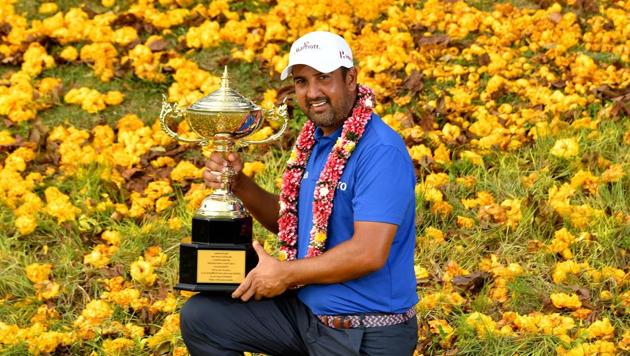 India’s Shiv Kapur poses with the winner’s trophy after his victory in the final round of the Royal Cup golf tournament at the Phoenix Gold Golf and Country Club in Pattaya.(AFP)