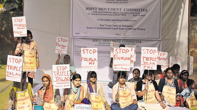 Activists of various social organisations hold placards during a protest against Triple Talaq, in May.(AP file)