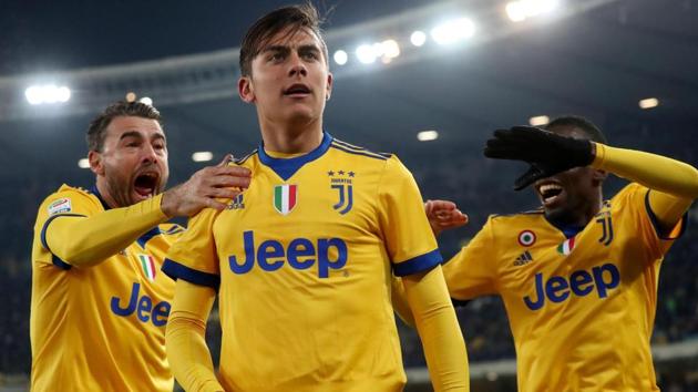 Juventus' Paulo Dybala, center, celebrates with teammates after scoring against Hellas Verona in their Serie A clash. (AP) Juventus' Paulo Dybala, center, celebrates with teammates after scoring against Hellas Verona in their Serie A clash. (AP)