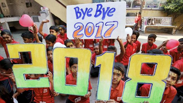 Students pose with placards that read '2018', to give out new year wishes, in Ahmedabad on Saturday. (PTI Photo) Students pose with placards that read '2018', to give out new year wishes, in Ahmedabad on Saturday. (PTI Photo)