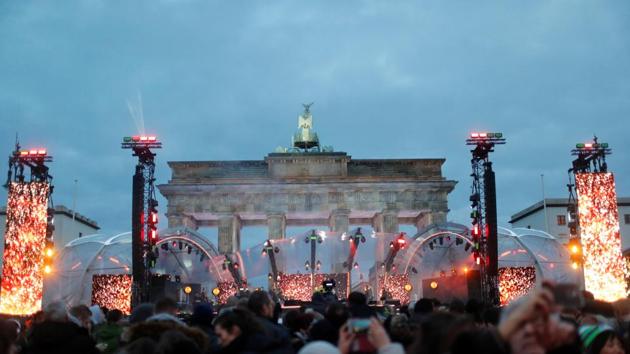 People gather near the Brandenburg Gate, ahead of the upcoming New Year's Eve celebrations in Berlin, Germany. (REUTERS) People gather near the Brandenburg Gate, ahead of the upcoming New Year's Eve celebrations in Berlin, Germany. (REUTERS)