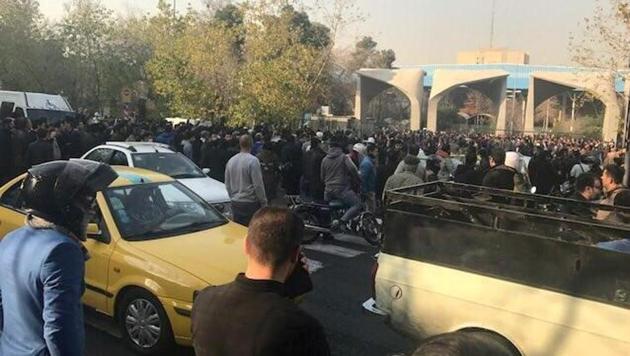 People protest near the university of Tehran on December 30, 2017 in this picture obtained from social media.(Reuters)