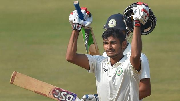 Vidarbha's batsman Akshay Wadkar celebrates his century during the 3rd day of the Ranji Trophy final against Delhi in Indore on Sunday. (PTI) Vidarbha's batsman Akshay Wadkar celebrates his century during the 3rd day of the Ranji Trophy final against Delhi in Indore on Sunday. (PTI)