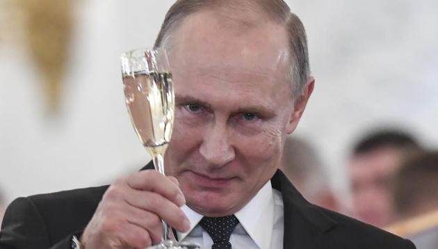 Russian President Vladimir Putin makes a toast during an award ceremony in the Kremlin, in Moscow, Russia, Thursday, Dec. 28, 2017, for Russian Armed Forces service personnel who took part in the anti-terrorist operation in Syria.(AP)