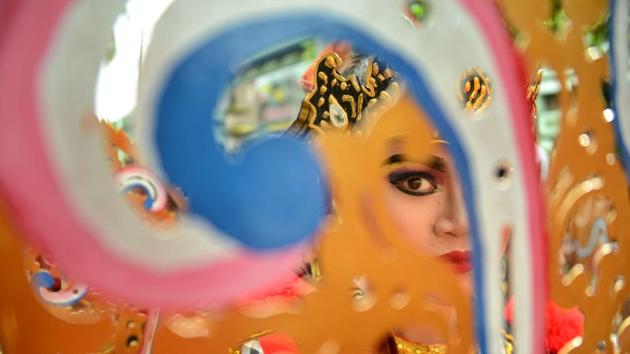 A Balinese girl takes part in a traditional dance during in a cultural parade at a festival to mark the New Year in Denpasar on Bali island. (Sonny Tumbelka / AFP) A Balinese girl takes part in a traditional dance during in a cultural parade at a festival to mark the New Year in Denpasar on Bali island. (Sonny Tumbelka / AFP)
