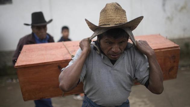 Exhumations in Santa Avelina started in 2014 and in late November forensic anthropologists handed over the remains of 172 people who perished during the years of military control. Their bones and tattered bits of clothing were re-buried individually by surviving family members after over more than three decades in anonymous mass graves. (Luis Soto / AP)