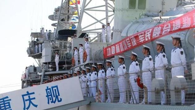 Chinese People's Liberation Army navy soldiers stand on a decommissioned destroyer in an aircraft carrier theme park during a celebration event on China's Navy Day at Binhai New Area, Tianjin, China, April 23, 2017.(Reuters File Photo)
