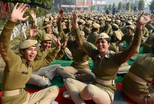 Police personnel participate in a ‘laughing session’ during New Year celebrations at the recruitment centre in Jalandhar on Monday. (Pardeep Pandit/HT)