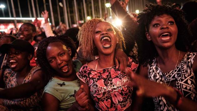 People react after counting down to New Year's day on January 1, 2018, during the New Year's music event at Kenyatta International Convention Centre (KICC) in Nairobi, Kenya. (Yasuyoshi Chiba / AFP) People react after counting down to New Year's day on January 1, 2018, during the New Year's music event at Kenyatta International Convention Centre (KICC) in Nairobi, Kenya. (Yasuyoshi Chiba / AFP)