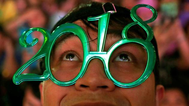 People celebrate New Year at Eastwood mall in Quezon City Metro Manila in the Philippines. (Erik De Castro / REUTERS) People celebrate New Year at Eastwood mall in Quezon City Metro Manila in the Philippines. (Erik De Castro / REUTERS)