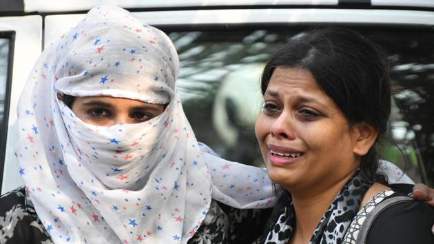 The relatives of one of the 1Above pub managers wait for him outside the Bhoiwada metropolitan magistrate’s court, where he and a co-accused were produced on Monday. (PTI) The relatives of one of the 1Above pub managers wait for him outside the Bhoiwada metropolitan magistrate’s court, where he and a co-accused were produced on Monday. (PTI)