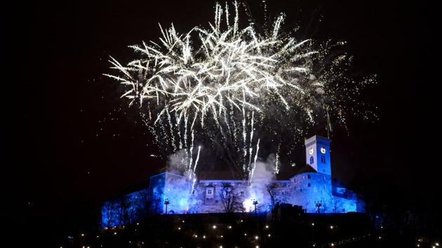 Fireworks explode above Ljubljana castle during New Year's celebrations after midnight in Ljubljana, Slovenia. (Jure Makovec / AFP) Fireworks explode above Ljubljana castle during New Year's celebrations after midnight in Ljubljana, Slovenia. (Jure Makovec / AFP)