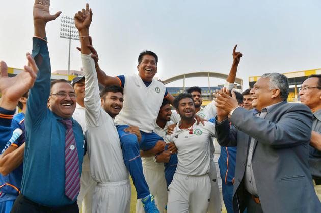 Vidarbha players celebrate with their coach Chandrakant Pandit after winning the Ranji Trophy final cricket match against Delhi, January 1. (PTI) Vidarbha players celebrate with their coach Chandrakant Pandit after winning the Ranji Trophy final cricket match against Delhi, January 1. (PTI)