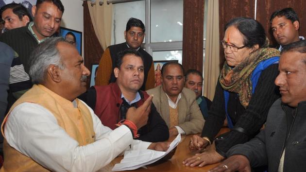 School education minister Arvind Pandey at the Janta Darshan in the BJP headquarters in Dehradun on Tuesday.(Vinay Sanotsh Kumar/HT)