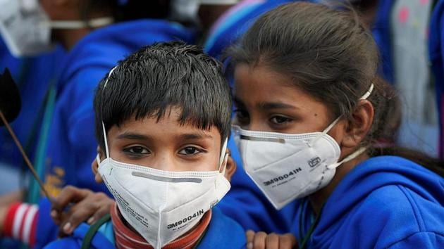 Children wear air masks as they attend a demonstration to spread awareness about the effects of air pollution in Delhi.(PTI)
