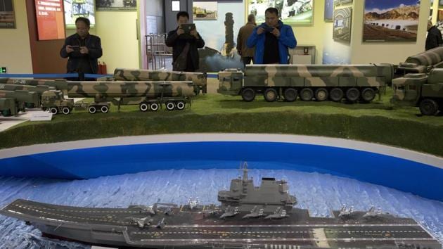 Visitors take photos near models of Chinese ballistic missiles and aircraft carrier an exhibition highlighting China's achievements under five years of his leadership at the Beijing Exhibition Hall in Beijing . (AP File Photo) Visitors take photos near models of Chinese ballistic missiles and aircraft carrier an exhibition highlighting China's achievements under five years of his leadership at the Beijing Exhibition Hall in Beijing . (AP File Photo)