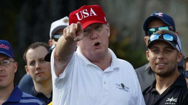 President Donald Trump speaks as he meets with members of the US Coast Guard, who he invited to play golf, at Trump International Golf Club, on December 29, 2017, in Florida. (AP Photo) President Donald Trump speaks as he meets with members of the US Coast Guard, who he invited to play golf, at Trump International Golf Club, on December 29, 2017, in Florida. (AP Photo)