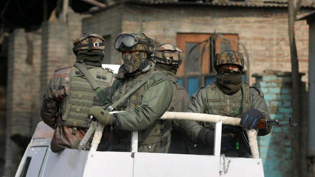 Army personnel move towards the CRPF training camp during the second day of encounter with militants, at Lethpora in Pulwama district of south Kashmir. (PTI Photo) Army personnel move towards the CRPF training camp during the second day of encounter with militants, at Lethpora in Pulwama district of south Kashmir. (PTI Photo)
