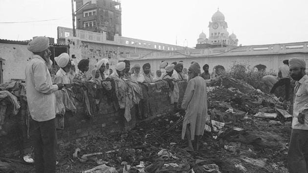Devotees look at the damage inflicted on the Golden Temple in Amritsar after the Operation Bluestar in 1984. Even after 33 years, the Shiromani Gurdwara Parbandhak Committee (SGPC) has preserved 147 bullet marks on the walls of its HQ, so they can serve as evidence in a Rs. 1,000-crore suit related to a military attack on the Golden Temple during Operation Blue Star. (HT Archive) Devotees look at the damage inflicted on the Golden Temple in Amritsar after the Operation Bluestar in 1984. Even after 33 years, the Shiromani Gurdwara Parbandhak Committee (SGPC) has preserved 147 bullet marks on the walls of its HQ, so they can serve as evidence in a Rs. 1,000-crore suit related to a military attack on the Golden Temple during Operation Blue Star. (HT Archive)