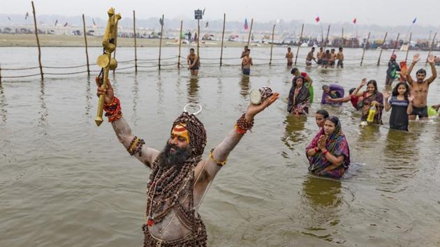 A priest offers prayers after taking the ritual dips in the water at the “Sangam”, on the auspicious day of “Paush Purnima” during the annual traditional fair of Magh Mela in Allahabad. Hundreds of thousands of devotees are expected to take holy dips at the confluence during the astronomically auspicious period of over 45 days starting today celebrated as Magh Mela. (Rajesh Kumar Singh / AP) A priest offers prayers after taking the ritual dips in the water at the “Sangam”, on the auspicious day of “Paush Purnima” during the annual traditional fair of Magh Mela in Allahabad. Hundreds of thousands of devotees are expected to take holy dips at the confluence during the astronomically auspicious period of over 45 days starting today celebrated as Magh Mela. (Rajesh Kumar Singh / AP)
