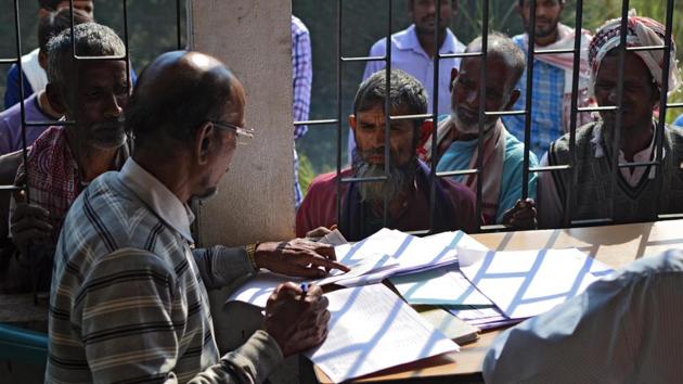 People wait to check their names on the first draft of the National Register of Citizens (NRC) at Goroimari of Kamrup district in the Indian state of Assam on January 1. (AFP Photo) People wait to check their names on the first draft of the National Register of Citizens (NRC) at Goroimari of Kamrup district in the Indian state of Assam on January 1. (AFP Photo)