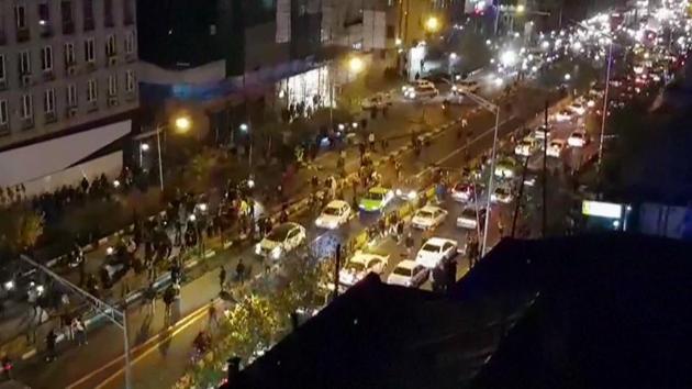 A video grab shows a group of protesters walking down a street in Tehran on December 30, 2017. Protests against economic hardships and alleged corruption erupted in Iran’s second city of Mashhad on December 28, 2017 and escalated into calls for the religious establishment to step down. Some of the anger was directed at Ayatollah Ali Khamenei, with video posted on social media showing people on the streets, some chanting “Death to the dictator!” (Mehr News / AFP) A video grab shows a group of protesters walking down a street in Tehran on December 30, 2017. Protests against economic hardships and alleged corruption erupted in Iran’s second city of Mashhad on December 28, 2017 and escalated into calls for the religious establishment to step down. Some of the anger was directed at Ayatollah Ali Khamenei, with video posted on social media showing people on the streets, some chanting “Death to the dictator!” (Mehr News / AFP)
