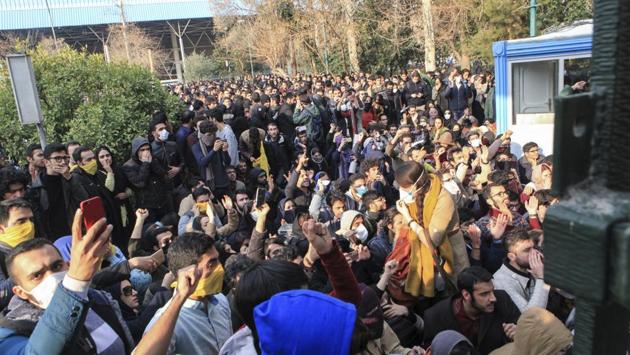 University students attend a protest inside Tehran University while anti-riot Iranian police prevent them from joining other protestors, in Tehran on December 30, 2017. As protests spread the Telegram app shut down a channel run by Roohallah Zam, an exiled journalist, after Iranian authorities complained that it was inciting violence and helped fan passions among those taking to the streets. (AP) University students attend a protest inside Tehran University while anti-riot Iranian police prevent them from joining other protestors, in Tehran on December 30, 2017. As protests spread the Telegram app shut down a channel run by Roohallah Zam, an exiled journalist, after Iranian authorities complained that it was inciting violence and helped fan passions among those taking to the streets. (AP)