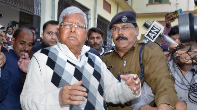 RJD supremo Lalu Prasad Yadav is escorted by police officials after being convicted by the special CBI court in fodder scam case, in Ranchi.(PTI Photo) RJD supremo Lalu Prasad Yadav is escorted by police officials after being convicted by the special CBI court in fodder scam case, in Ranchi.(PTI Photo)