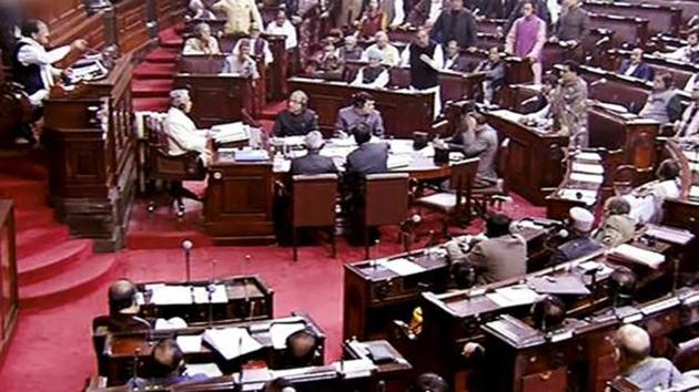 Opposition members protest inside the Rajya Sabha in New Delhi during the winter session of Parliament.(PTI Photo)