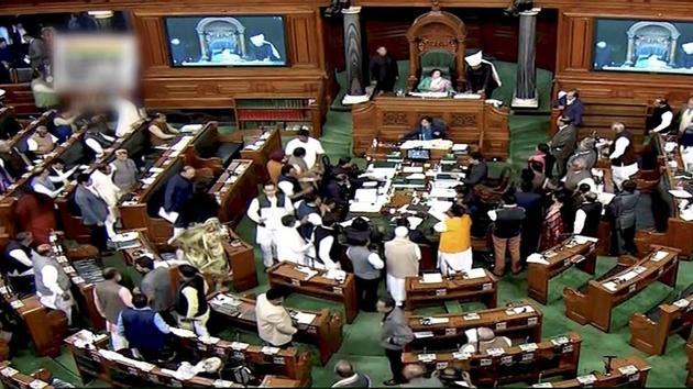 Opposition members protest in the well of the Lok Sabha in New Delhi.(PTI FILE) Opposition members protest in the well of the Lok Sabha in New Delhi.(PTI FILE)