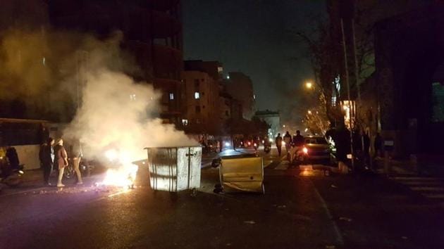 Demonstrators block streets and burn public property in Tehran on December 30, 2017. Almost nine years since the reformist protests were crushed, Iran’s adversaries voiced support for the resurgence of anti-government sentiment. US President Donald Trump tweeted: “The great Iranian people have been repressed for many years. They are hungry for food & for freedom. Along with human rights, the wealth of Iran is being looted. TIME FOR CHANGE!” (REUTERS) Demonstrators block streets and burn public property in Tehran on December 30, 2017. Almost nine years since the reformist protests were crushed, Iran’s adversaries voiced support for the resurgence of anti-government sentiment. US President Donald Trump tweeted: “The great Iranian people have been repressed for many years. They are hungry for food & for freedom. Along with human rights, the wealth of Iran is being looted. TIME FOR CHANGE!” (REUTERS)