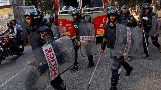 Riot police walk past a damaged public bus during a protest in Mumbai. Police also said that the situation was under control and that shops weren’t forcibly shut in Mulund. “People who took part in the agitation requested shopkeepers to close their shops,” said Shripad Kale, senior police inspector, Mulund police station (Danish Siddiqui / REUTERS) Riot police walk past a damaged public bus during a protest in Mumbai. Police also said that the situation was under control and that shops weren’t forcibly shut in Mulund. “People who took part in the agitation requested shopkeepers to close their shops,” said Shripad Kale, senior police inspector, Mulund police station (Danish Siddiqui / REUTERS)