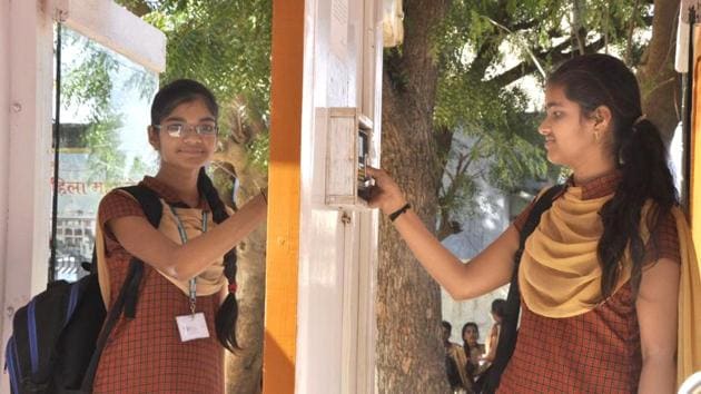 Girl students at Shri Bangad Mahila College in Nagaur’s Didwana marking attendance on a biometric machine.(HT Photo.)