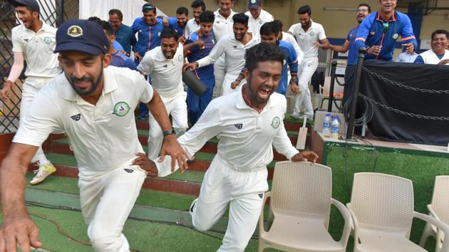 Vidarbha players celebrate after winning the Ranji Trophy final cricket match against Delhi by 9 wickets in Indore on Monday. (PTI) Vidarbha players celebrate after winning the Ranji Trophy final cricket match against Delhi by 9 wickets in Indore on Monday. (PTI)