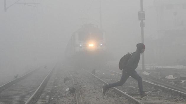 A man in Patna crosses a railway track as cold wave conditions continued to sweep across northern India on Tuesday. In Delhi, as many as 20 flights were delayed and six were cancelled, while 64 trains were delayed, 24 were rescheduled and 21 cancelled, while dense fog continued to shroud many places in Jammu and Kashmir and Punjab. (PTI) A man in Patna crosses a railway track as cold wave conditions continued to sweep across northern India on Tuesday. In Delhi, as many as 20 flights were delayed and six were cancelled, while 64 trains were delayed, 24 were rescheduled and 21 cancelled, while dense fog continued to shroud many places in Jammu and Kashmir and Punjab. (PTI)