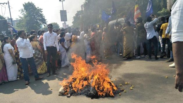 Dalit protesters burnt PM Narendra Modi and Maharashtra CM Devendra Fadnavis effigies at Lokmanya Nager, Thane. Security has been stepped up in Mumbai in view of a bandh called by a Dalit group. Several towns and cities in Maharashtra are on the edge over protests against the Pune violence over the death of a 28-year-old man near the bicentennial celebrations of a British-era war in Pune. (Praful Gangurde / HT Photo) Dalit protesters burnt PM Narendra Modi and Maharashtra CM Devendra Fadnavis effigies at Lokmanya Nager, Thane. Security has been stepped up in Mumbai in view of a bandh called by a Dalit group. Several towns and cities in Maharashtra are on the edge over protests against the Pune violence over the death of a 28-year-old man near the bicentennial celebrations of a British-era war in Pune. (Praful Gangurde / HT Photo)