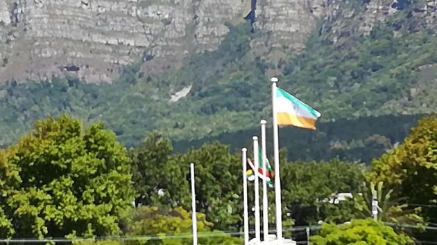 The Indian national flag stayed with the green colour up for the earlier part of the Indian team training till someone from the Newlands Stadium ground staff noticed it and quickly hoisted it again the right way. Indian cricket team will play South Africa cricket team in the first of the three Tests at the venue in Cape Town. (HT Photo) The Indian national flag stayed with the green colour up for the earlier part of the Indian team training till someone from the Newlands Stadium ground staff noticed it and quickly hoisted it again the right way. Indian cricket team will play South Africa cricket team in the first of the three Tests at the venue in Cape Town. (HT Photo)