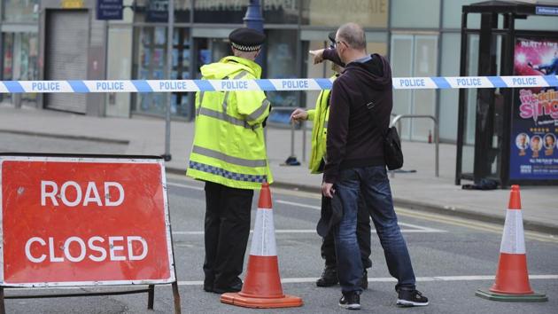 Police block a road near to the Manchester Arena in central Manchester, England Tuesday, May 23, 2017. (AP Photo) Police block a road near to the Manchester Arena in central Manchester, England Tuesday, May 23, 2017. (AP Photo)