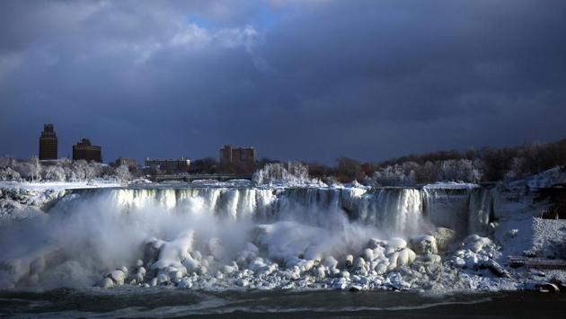 Water flows over the American Falls as ice forms in this view from the Canadian side in Niagara Falls, Ontario. Although everything around them freezes, the three waterfalls that make up the natural attraction between the United States and Canada continue to flow and churn up the frosty mist. (Aaron Lynett / The Canadian Press via AP) Water flows over the American Falls as ice forms in this view from the Canadian side in Niagara Falls, Ontario. Although everything around them freezes, the three waterfalls that make up the natural attraction between the United States and Canada continue to flow and churn up the frosty mist. (Aaron Lynett / The Canadian Press via AP)