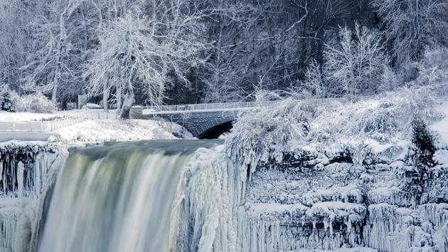 Water flows over the Bridal Veil Falls in Niagara Falls, New York with the rock faces covered in frozen mist and icicles. Such surreal scenes of freezing have been seen all the way down to Georgia where January’s average high is 16 degrees. (Aaron Lynett / The Canadian Press via AP) Water flows over the Bridal Veil Falls in Niagara Falls, New York with the rock faces covered in frozen mist and icicles. Such surreal scenes of freezing have been seen all the way down to Georgia where January’s average high is 16 degrees. (Aaron Lynett / The Canadian Press via AP)