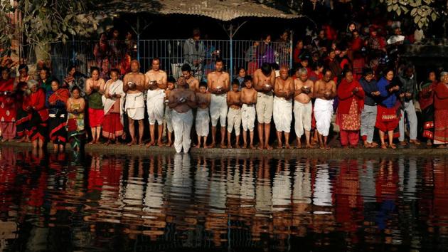 Devotees line up along the bank of the Hanumante River in prayer. The festival concludes with an Ashwamegha Yagya, where devotees worship Shiva for whole night. On that day all offerings including incense, sweets and even flowers are presented in 108 pieces and distributed among the male members of the family or immersed into the river. (Navesh Chitrakar / REUTERS) Devotees line up along the bank of the Hanumante River in prayer. The festival concludes with an Ashwamegha Yagya, where devotees worship Shiva for whole night. On that day all offerings including incense, sweets and even flowers are presented in 108 pieces and distributed among the male members of the family or immersed into the river. (Navesh Chitrakar / REUTERS)