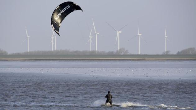 A kite surfer makes use of the wind caused by storm, Burglind in Dagebuell, Germany. Flights were disrupted at Frankfurt airport in Germany and at Zurich airport, as Swiss officials urged hikers to avoid forest walks. (Carsten Rehder / AP) A kite surfer makes use of the wind caused by storm, Burglind in Dagebuell, Germany. Flights were disrupted at Frankfurt airport in Germany and at Zurich airport, as Swiss officials urged hikers to avoid forest walks. (Carsten Rehder / AP)